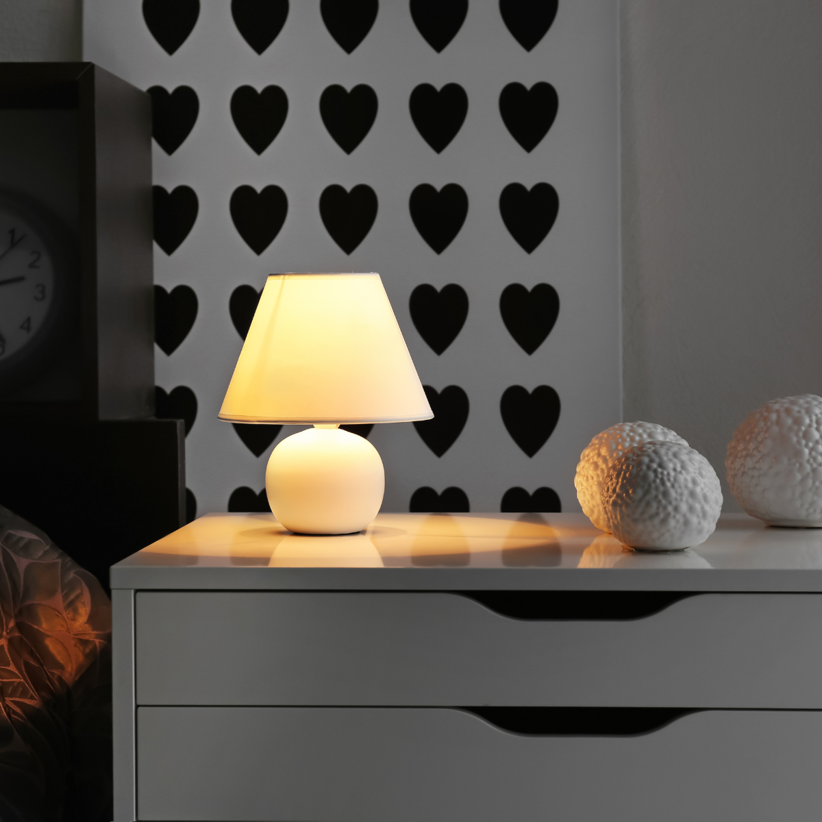 Modern nightstand with a lamp and storage for bedside essentials in a bedroom