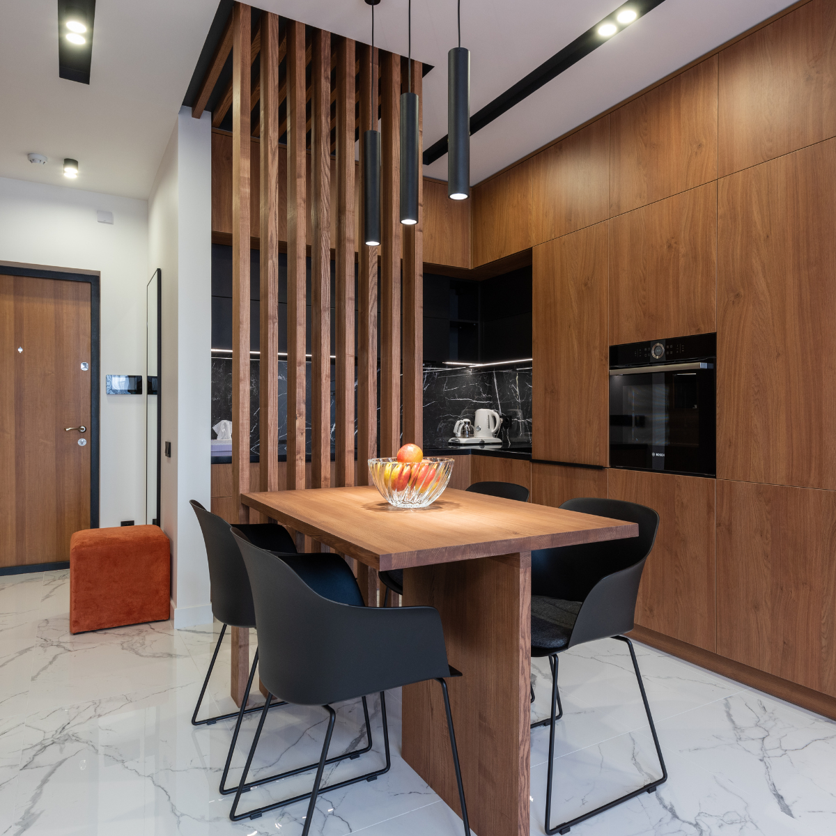 A beautiful wooden dining table with a rustic finish, surrounded by wooden chairs