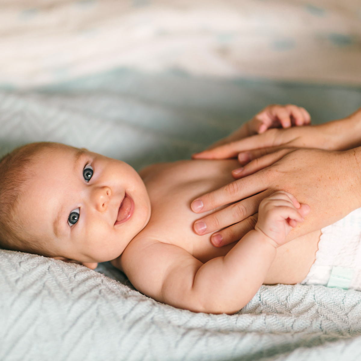 Natural oils like coconut, almond, and grapeseed are ideal for gentle baby massage techniques.